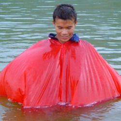 rain swimming in a poncho